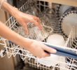 Why does glass tarnish in the dishwasher?